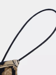 Close-up of spaghetti strap and neckline detail