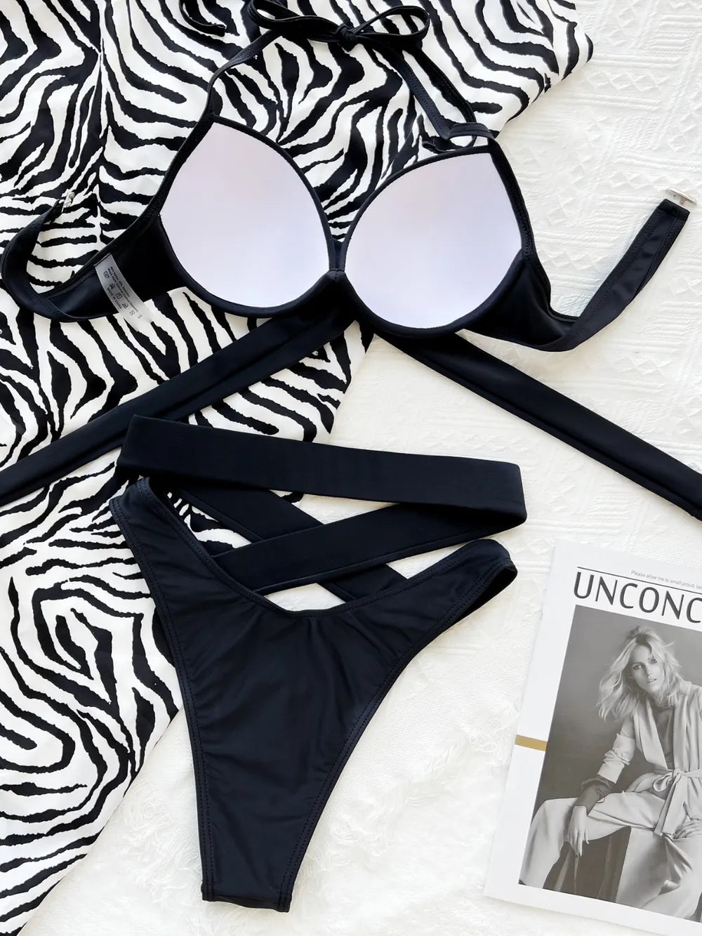Inside of black bikini top showing white cup lining