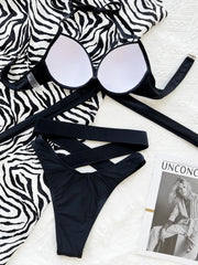 Inside of black bikini top showing white cup lining