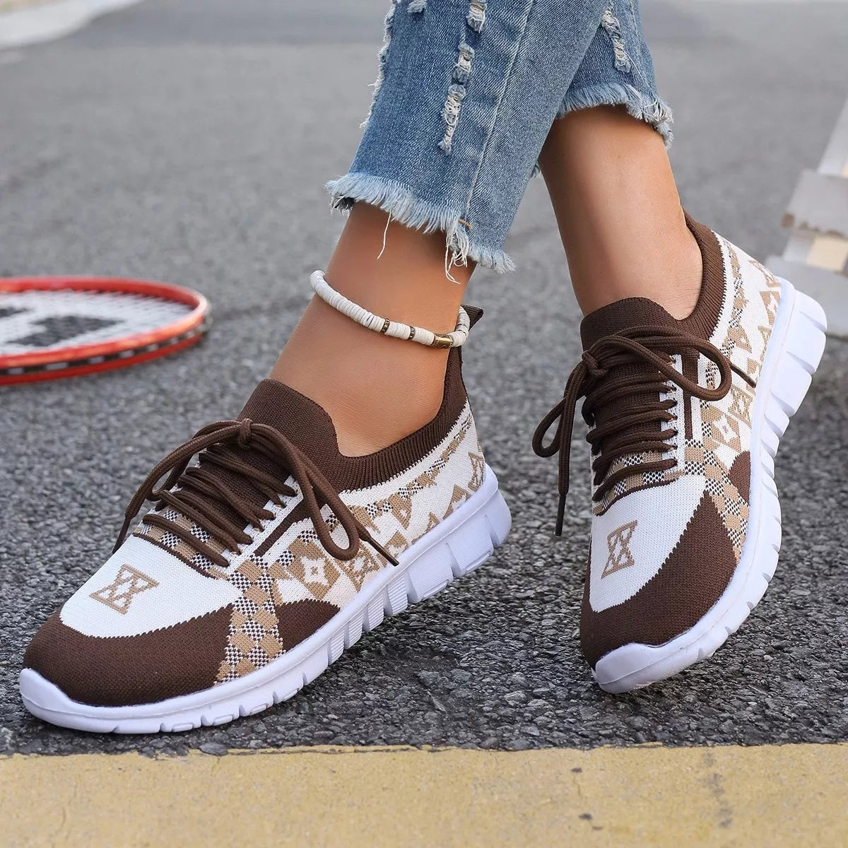 Brown mesh sneaker with cream geometric panels, close side view