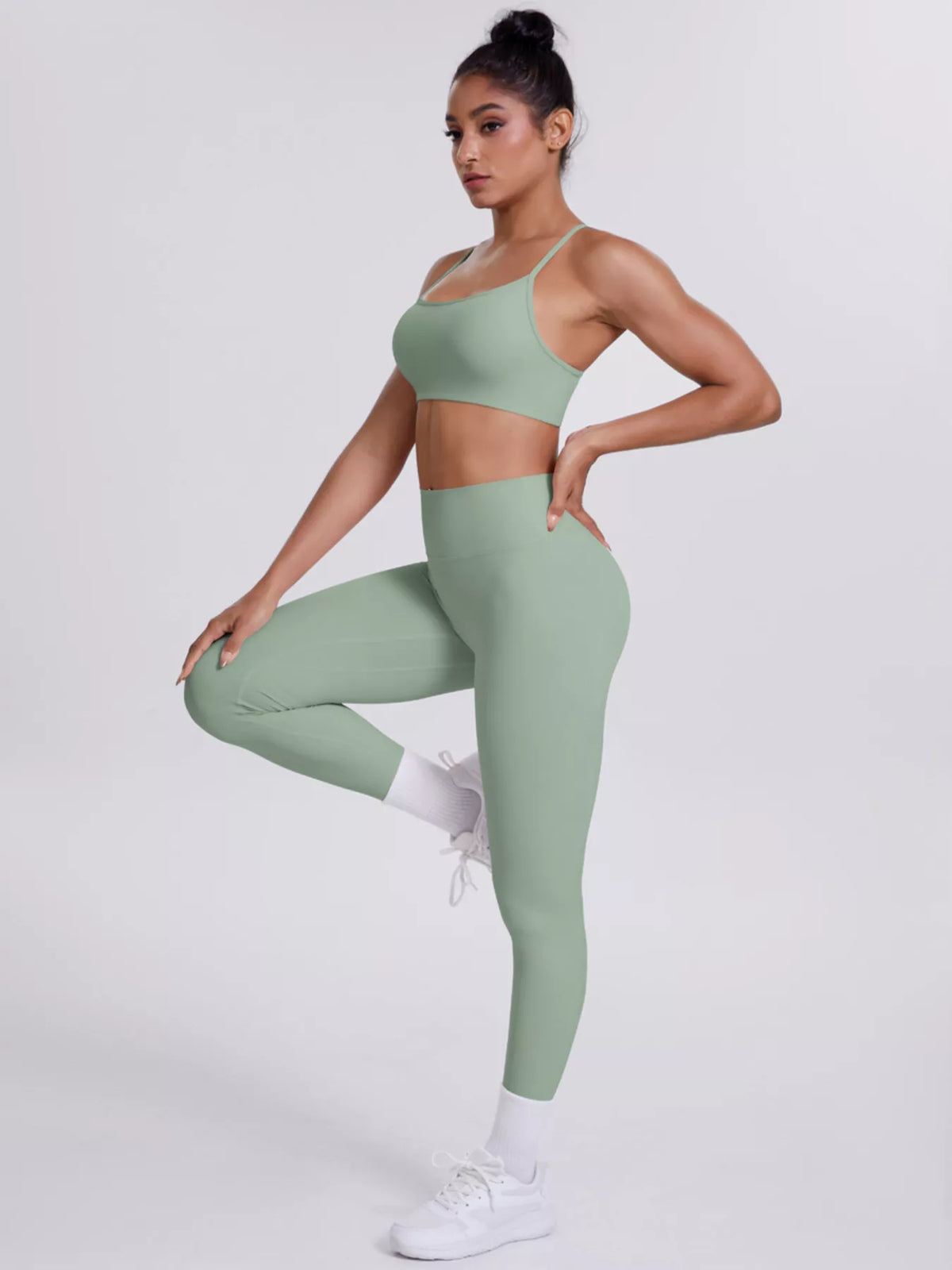 Full-length front view of criss-cross back cami and leggings active set