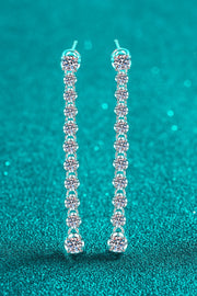 Adored 1.18 Carat Moissanite Long Earrings — Front view of long moissanite earrings on teal background