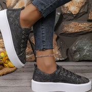 Charcoal platform sneakers worn with jeans