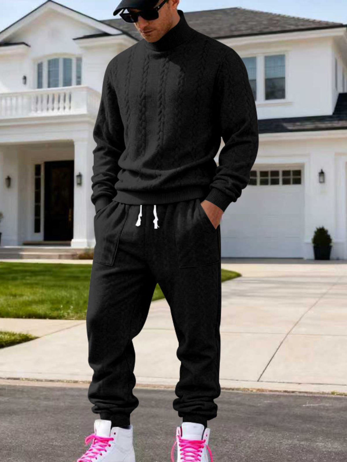 Black cable-knit mock-neck sweater and joggers worn front-facing.