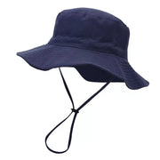 Navy children's bucket hat shown from the side with a wide brim and chin cord.