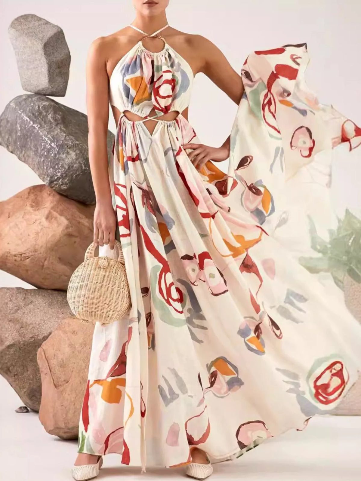 Close view of the white maxi dress's multicolor abstract pattern and tie detail.