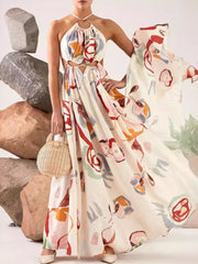 Close view of the white maxi dress's multicolor abstract pattern and tie detail.