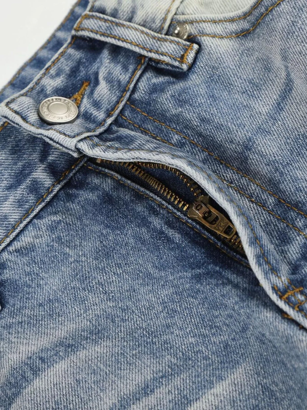 Close-up of jeans fly, button and waistband