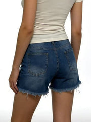 Rear view of blue denim shorts showing two patch pockets and frayed hems