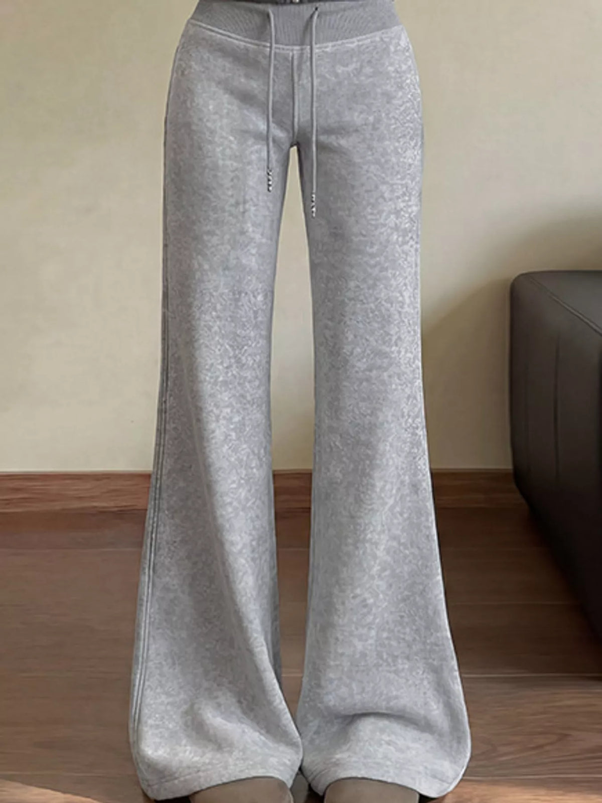 Grey drawstring wide-leg flare pants with a high elastic waist, front view
