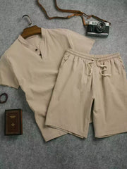 Beige short-sleeve two-button shirt and matching drawstring shorts laid flat