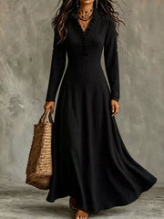 Black V-neck maxi dress with roll-up sleeves and waist tie, front view