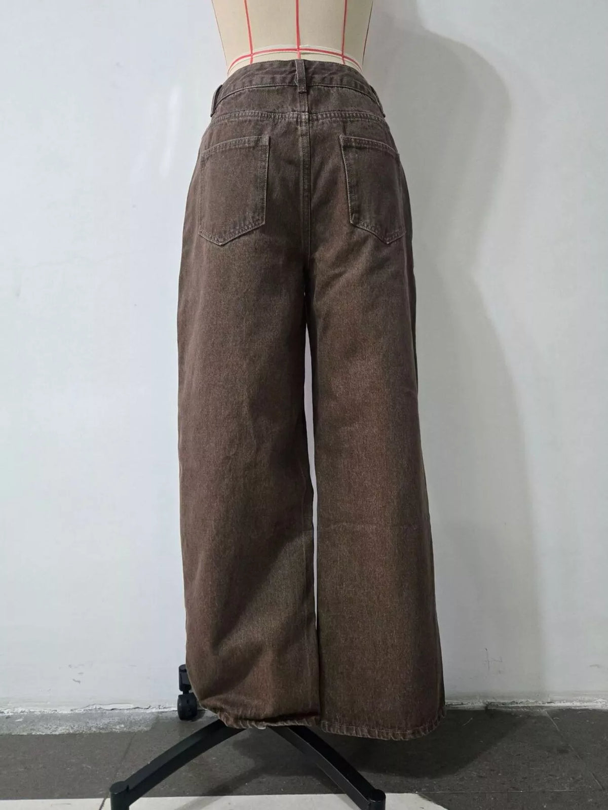 Back view of brown wide-leg jeans on a mannequin