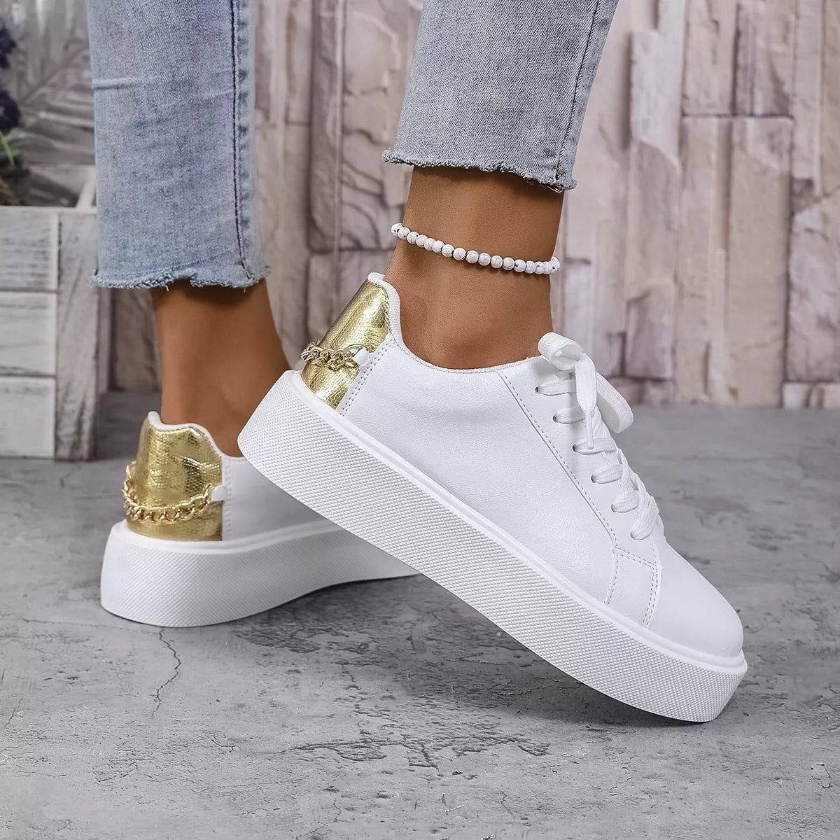 Close side view of white sneaker showing thick platform sole