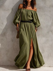 Model wearing moss-green off-shoulder maxi dress with long sleeves, belt and side slit