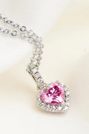 Pink heart-cut moissanite pendant with halo on silver-tone chain