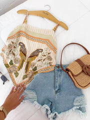 Parrot-print cami on hanger showing full bird motif