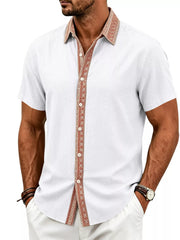 Model wearing navy shirt with patterned trim