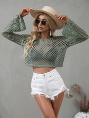 Front view of sage green openwork cropped cover-up with long flared sleeves.