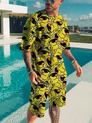 Yellow short-sleeve tee and shorts set with repeating cartoon faces wearing sunglasses.