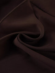 Close view of the dark brown dress fabric and folds