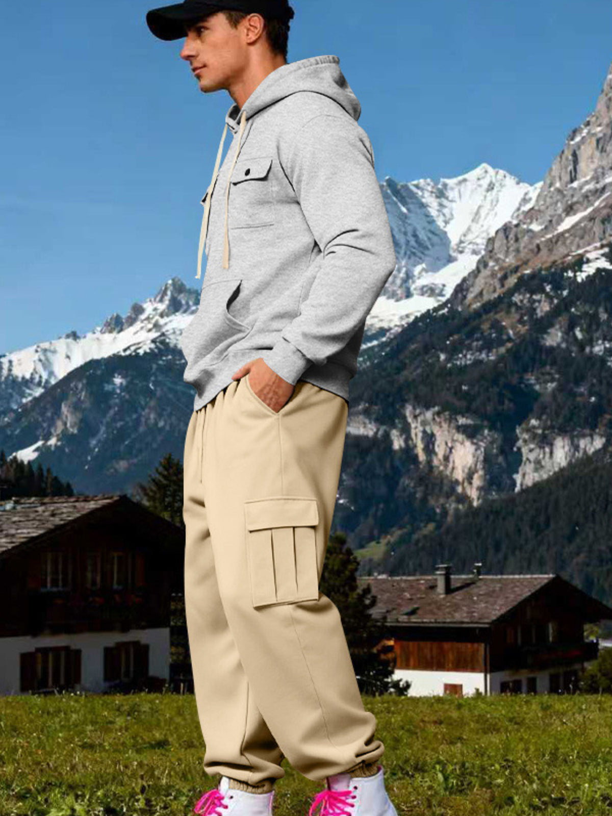 Side view of light grey hoodie and beige cargo joggers with ribbed ankle cuffs