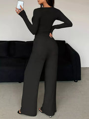 Back view of black long-sleeve top and wide-leg pants set