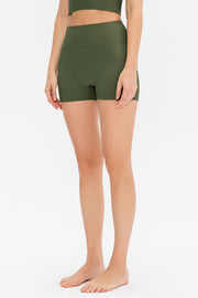 Model wearing dusty mauve ribbed shorts and matching crop top