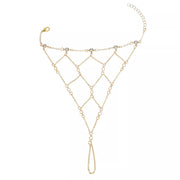 Gold-tone rhinestone hand bracelet displayed flat with finger loop and wrist chain