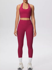 Burgundy halter activewear set shown with hand in leggings pocket