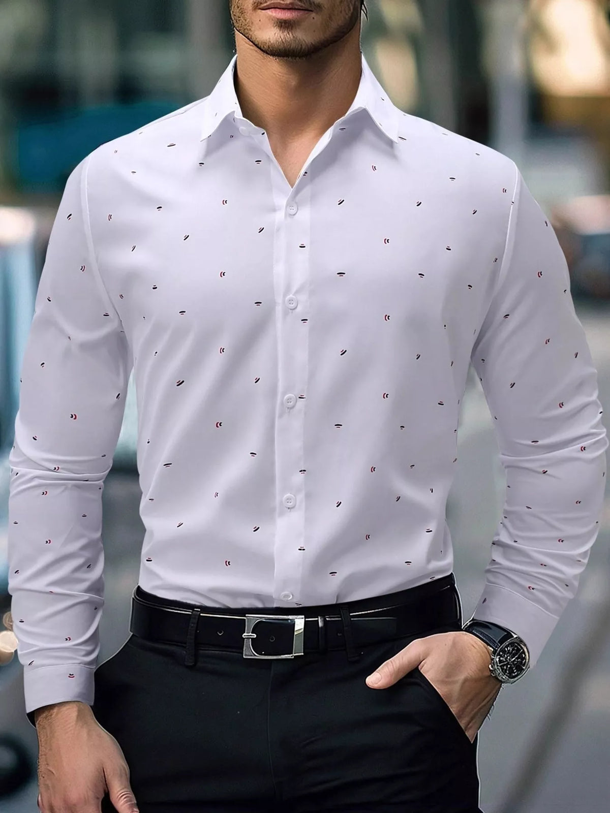 Model wearing a white slim-fit shirt with tiny red and black motifs tucked into black trousers