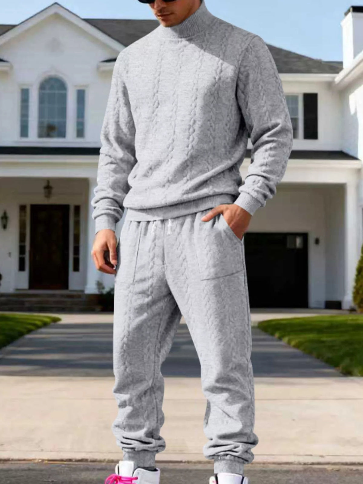 Light gray cable-knit mock-neck sweater and joggers shown in a closer front view.