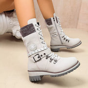 White lace-up boots with side zippers and buckle straps