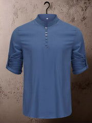 Close view of short button placket on tan shirt