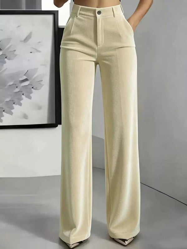Cream high-waisted velvet trousers with wide legs, belt loops and front pockets, full front view