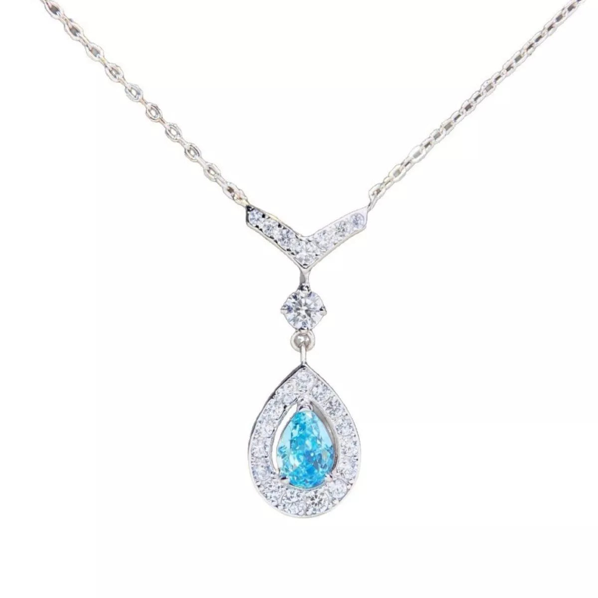 Close-up of the teardrop pendant and its silver-tone chain