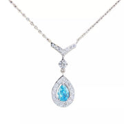 Close-up of the teardrop pendant and its silver-tone chain