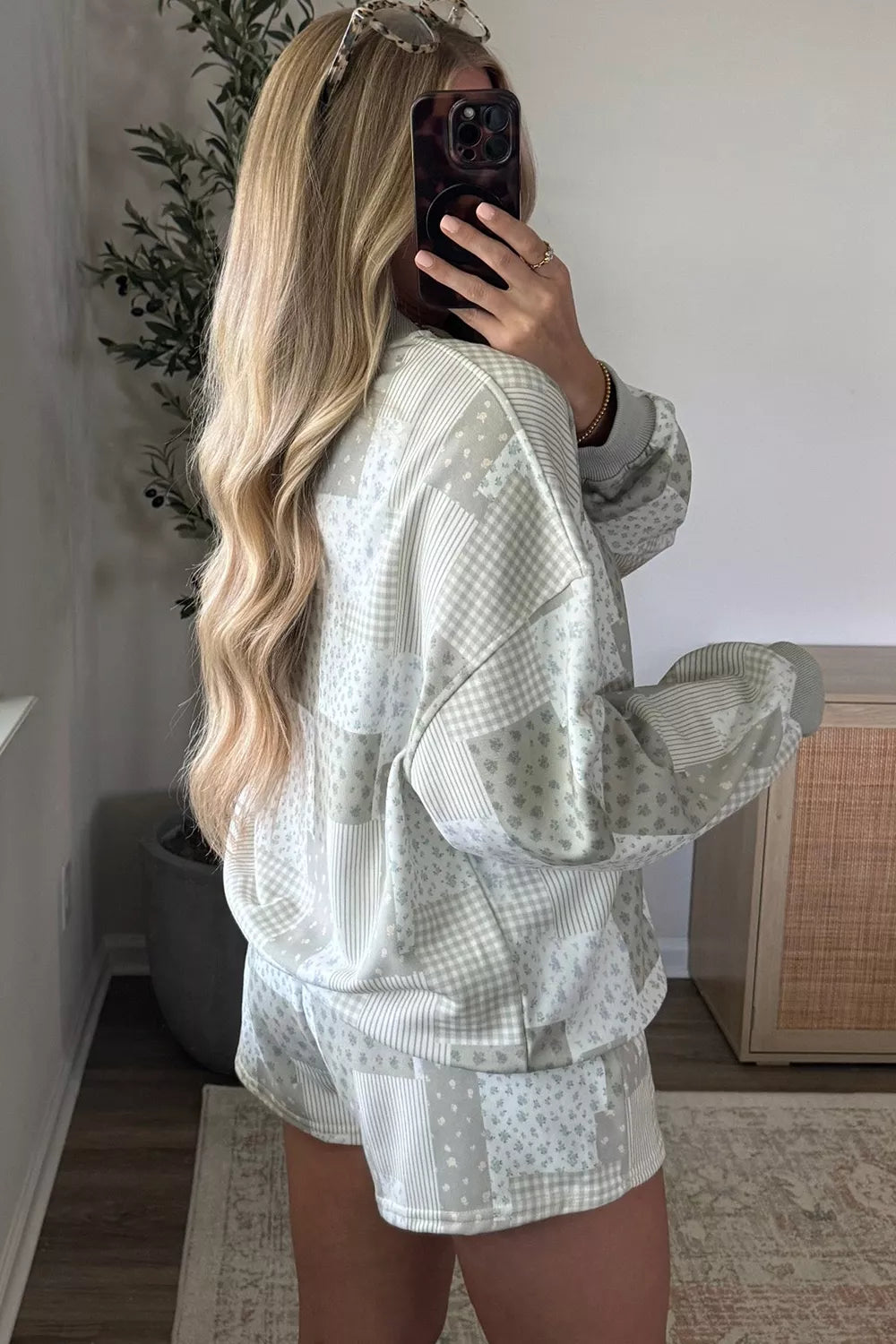 Side view of sage gray patchwork pullover and drawstring shorts