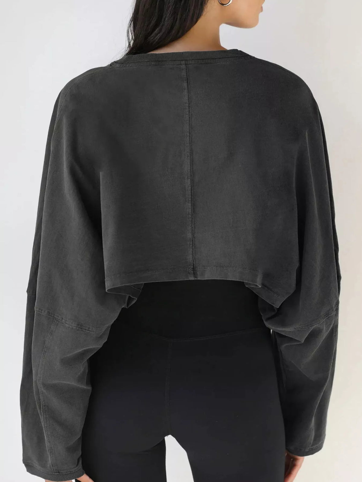 Back view of charcoal cropped sweatshirt with center seam