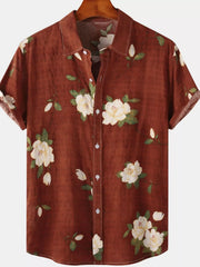 Rust-brown short-sleeve shirt with cream floral print, front view