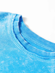 Women's mineral-wash blue raw-seam pocket sweatshirt, close-up of ribbed neckline