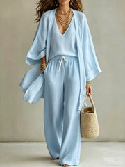 Full-length view of the pale blue cardigan and matching pants set.