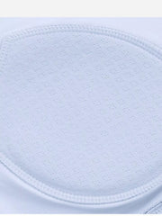 Close-up of light blue perforated bra cup padding and stitched edge