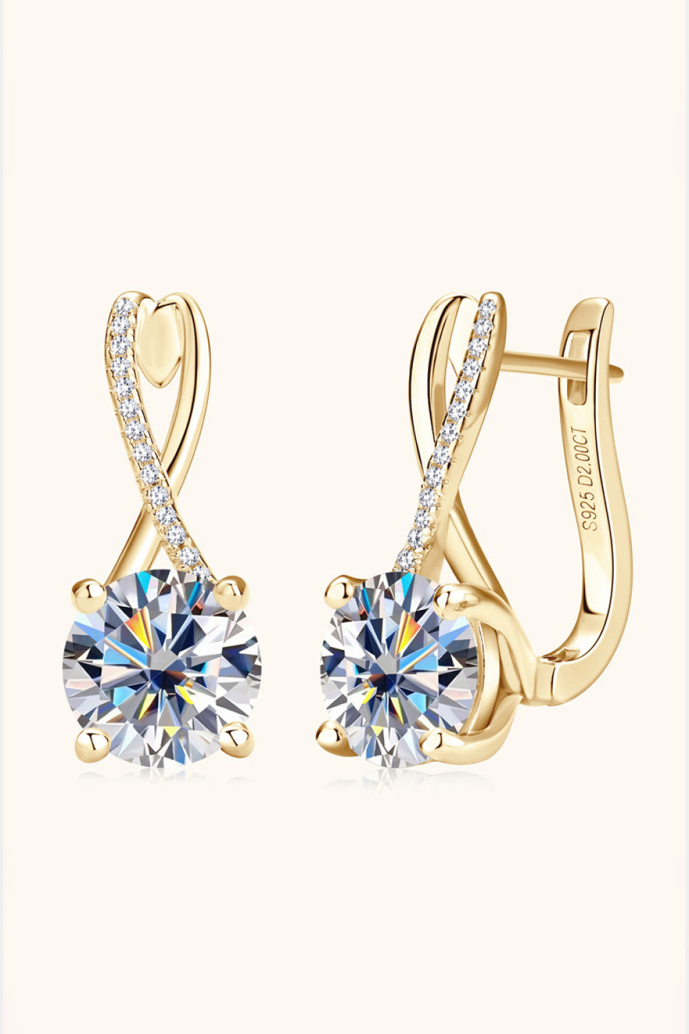 Gold-tone drop earrings with crossed loop tops and round clear stones