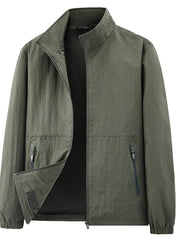 Dark olive jacket displayed alone with the zippered pockets and elastic cuffs visible