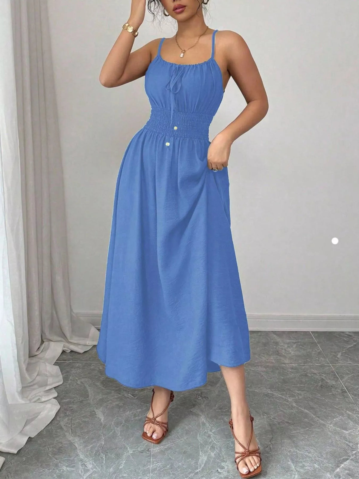 Brown smocked spaghetti-strap midi dress, front view
