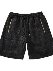 Front view of black paisley shorts with zip pockets
