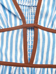 Blue halter dress detail showing smocked back and waist trim