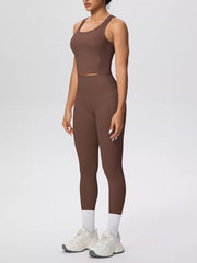 Brown activewear set shown in a side pose with one arm raised