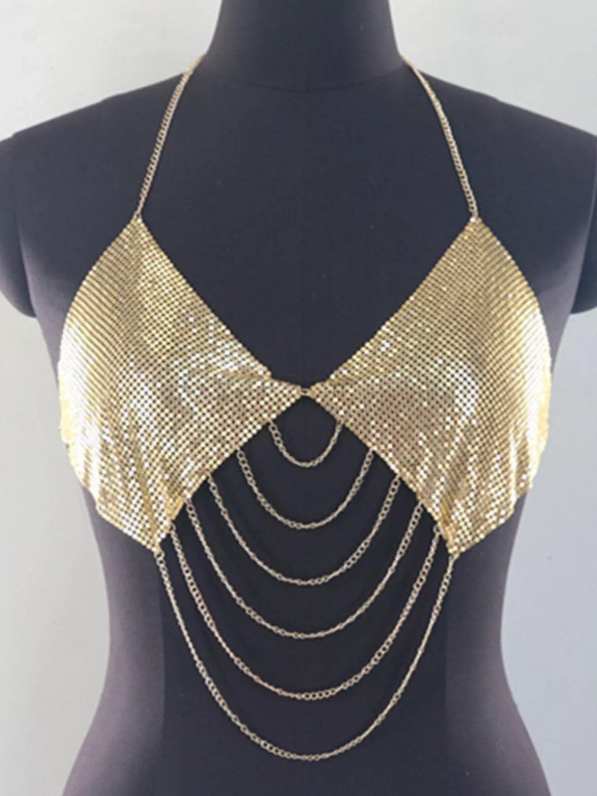Front view of gold chainmail halter top with draped chains